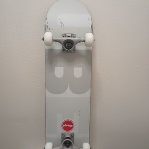 Zumiez White and Light Gray Almost Skateboard Deck with Trucks